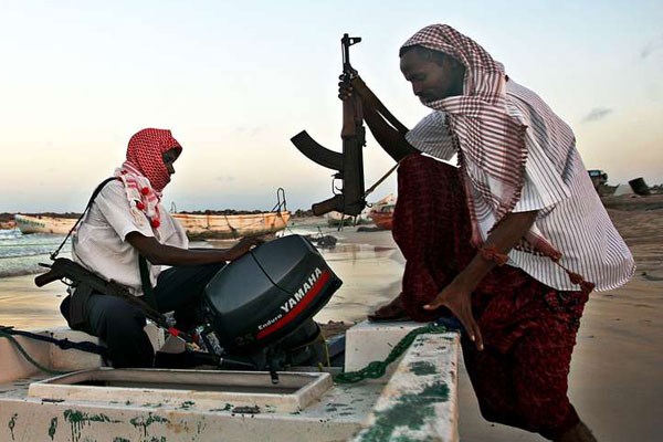 This photo taken on January 4, 2010 shows suspected armed Somali pirates carrying out preparations in Hobyo, northeastern Somalia. Now, in the past few weeks, Somali piracy is back, making headlines, boarding ships, and taking hostages. PHOTO | MOHAMED DAHIR | AFP